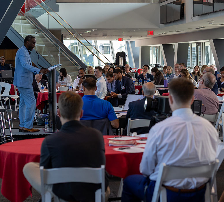 Speaker gives a talk at the 2022 Charge Against Cancer event.