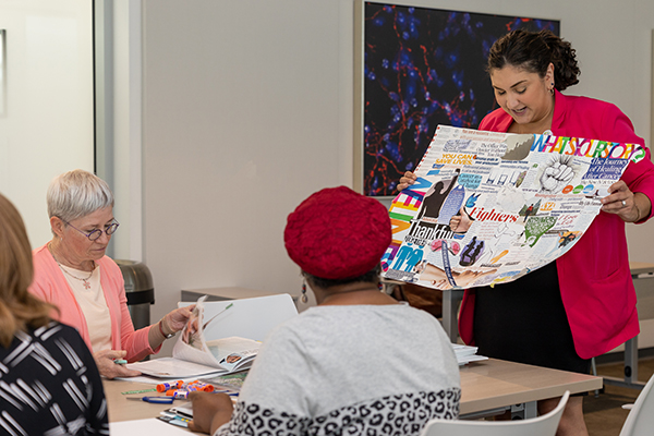 Drs. Shaughnessy and Topalian participate in a vision board event with other cancer survivors for the Survivorship program's event.