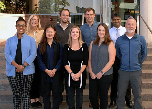 Group of K Scholars smiling on the steps of the UC College of Medicine.