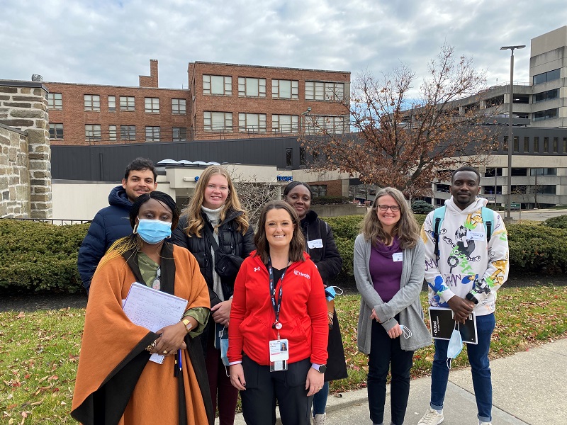 group of students and faculty standing outside university of cincinnati medical center