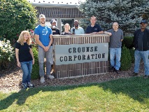group of students at by Crounse Corporation office sign