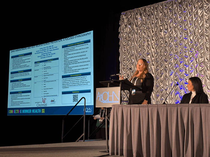 person on stage presenting