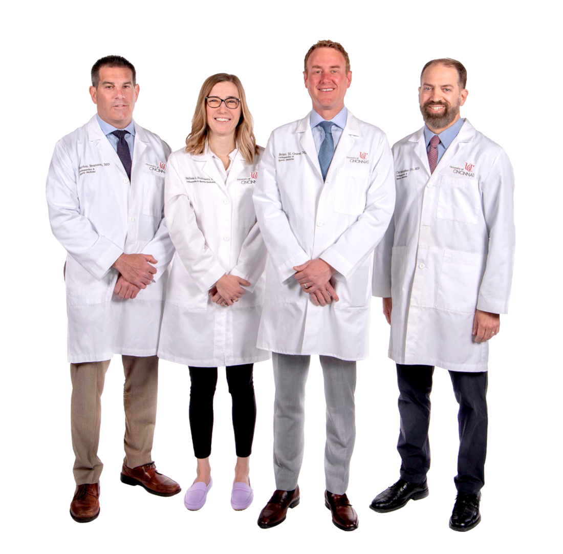 Four Doctors standing with lab coats