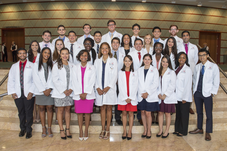 Dr. Mia Mallory at UC College of Medicine white coat ceremony with diverse students