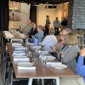 Group of people sitting at a table learning