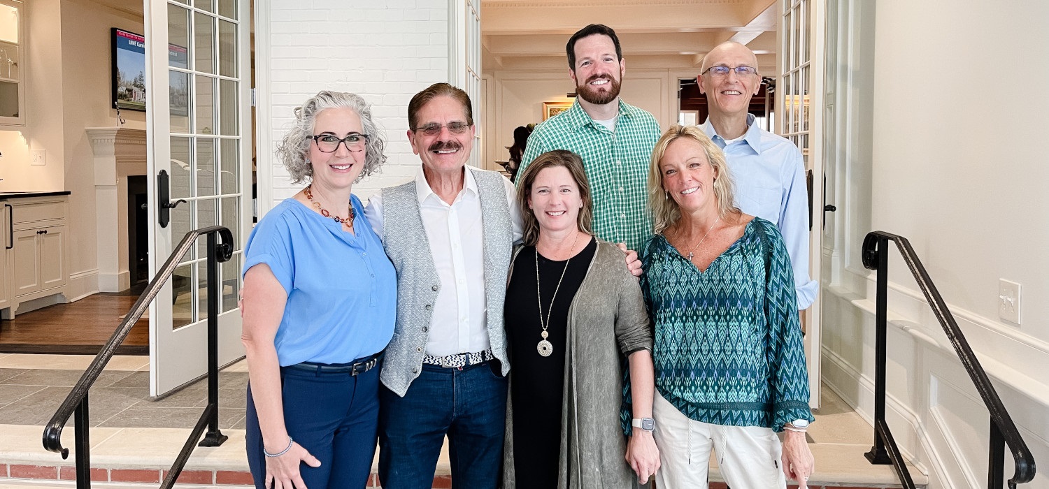 group of faculty leaders posing together at the faculty retreat