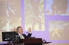 Speaker at podium on stage