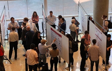 Photo of people discussing posters