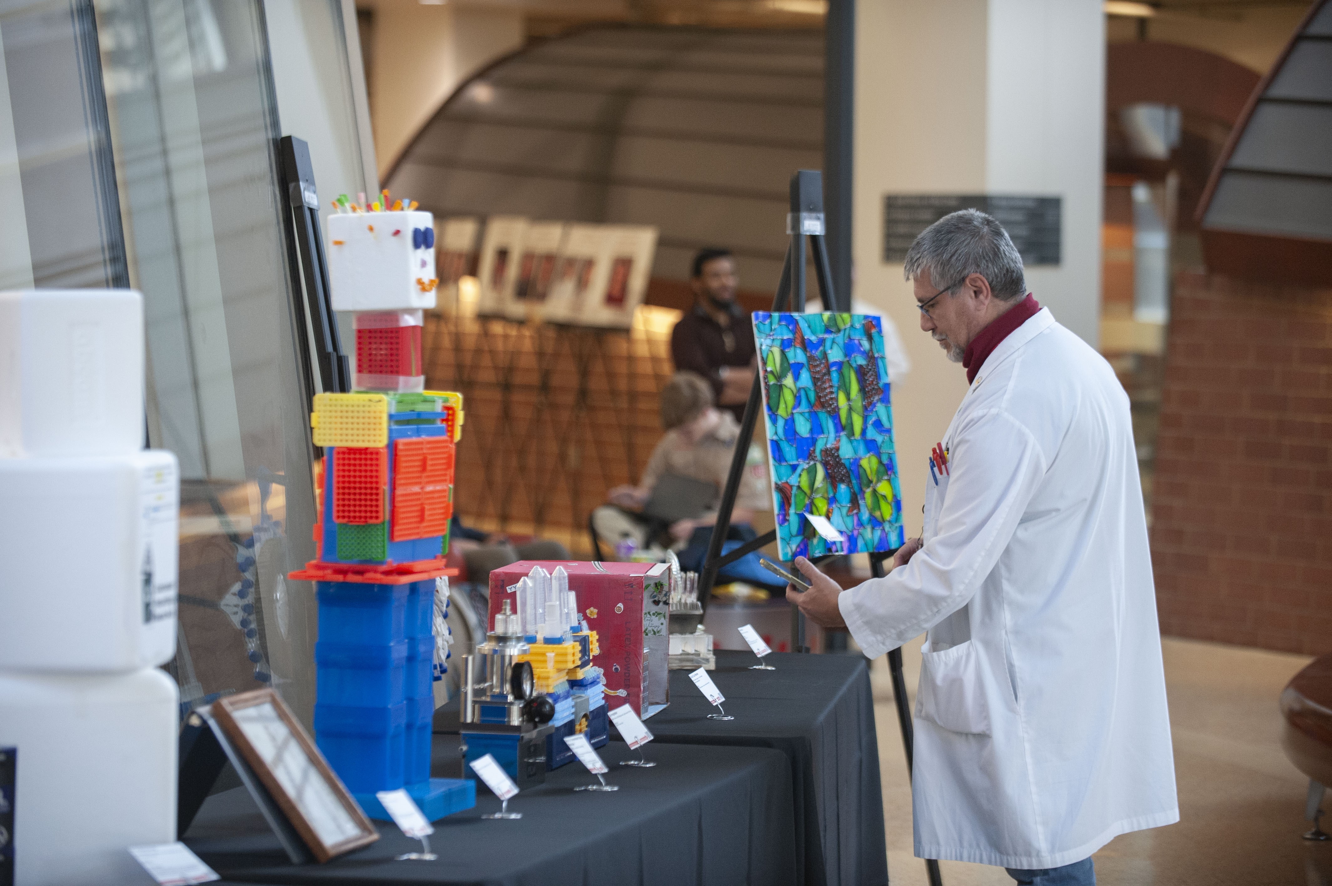 Person viewing art at the Art of Science Event