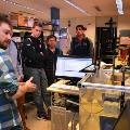 man-demonstrating-cnc-machine